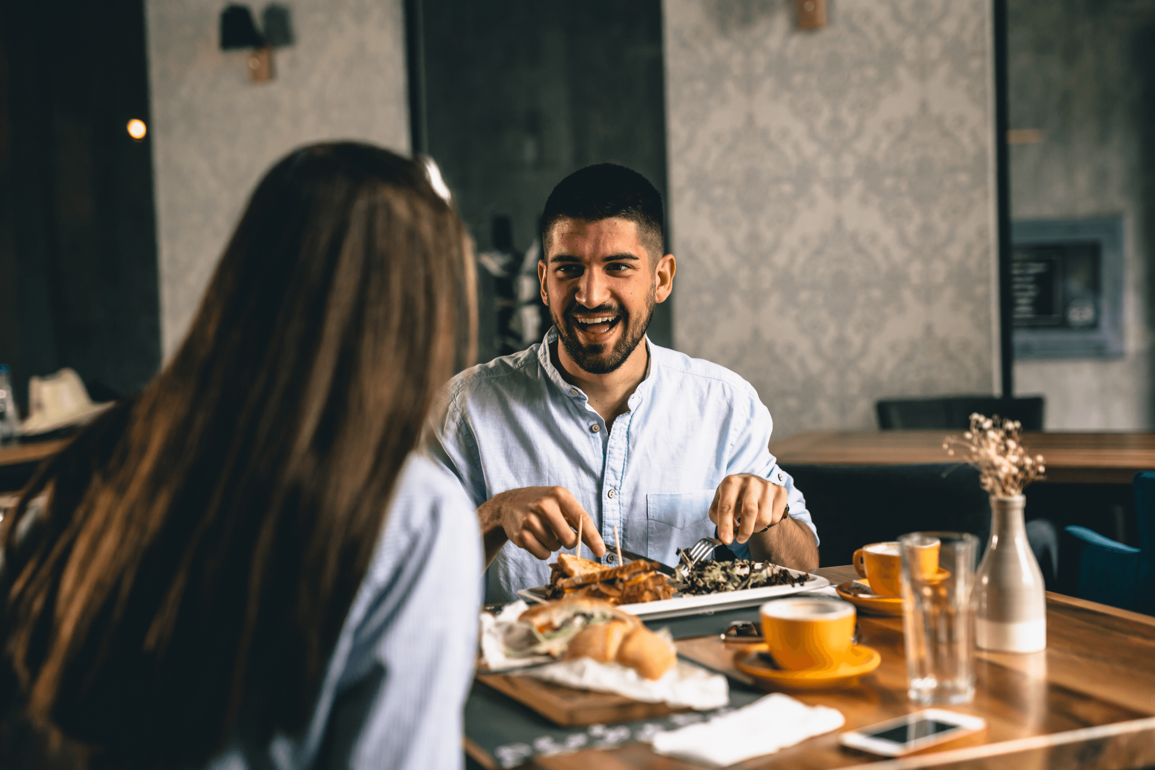 Happy customers enjoying their meal at a restaurant